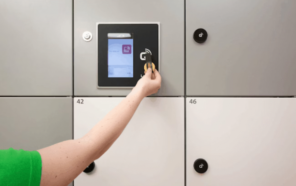 Where to Buy Smart Locker Storage Systems in Nigeria: Picture of an arm reaching out to unlock a smart locker with their access control tech.